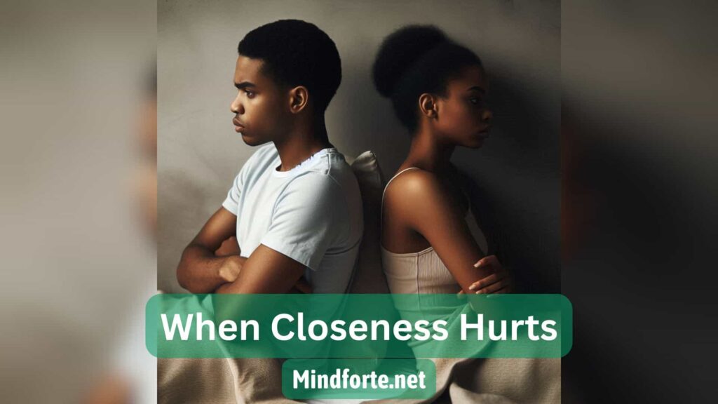A couple sits back-to-back in silence. Sometimes, love fades not from hate, but from fear and unspoken wounds. Learn how attachment styles quietly reshape connection.